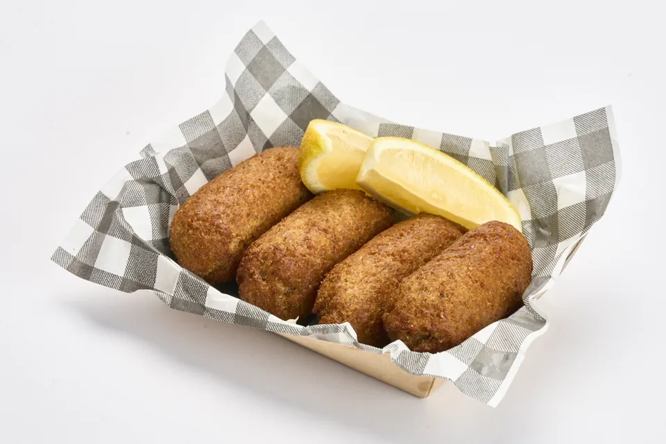 Koubes with lemon wedges